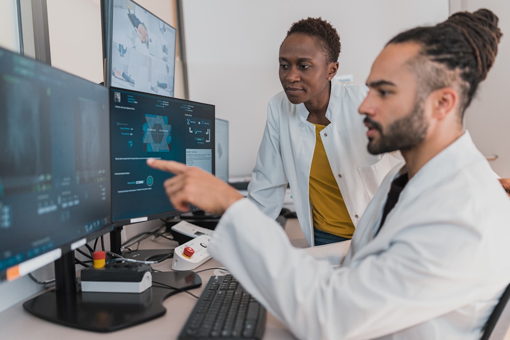Clinical team reviewing patient imaging on monitors
